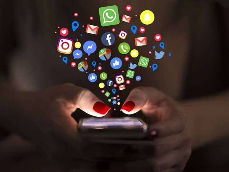 "User engaging with branded social media posts, likes, shares, and comments increasing brand visibility."